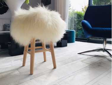 Wooden stool "Lina" sitting white Icelandic sheepskins